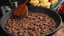 Close-up of a pan of cooked ground meat.