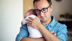 Dad holding baby