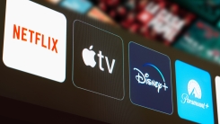 Netflix, Apple TV, Disney Plus and Paramount Plus logo is displayed on a TV screen.