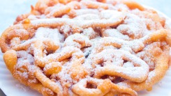 Funnel cake dusted with powdered sugar