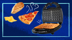 illustration of a waffle iron on blue background with waffles, pizza, chicken and cheese floating through the air