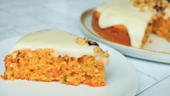 Slice of carrot cake on a plate.