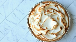 A meringue pie sitting on a countertop