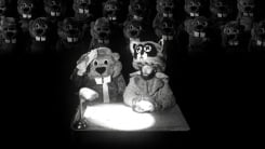 Two beavers sit at a table in a still from "Hundreds of Beavers."