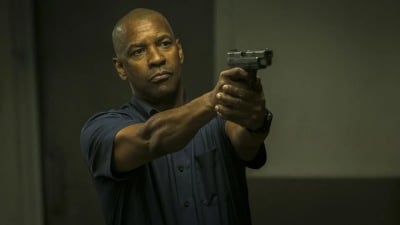 Denzel Washington holds a gun in The Equalizer