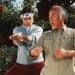 A screenshot of Miyagi (Pat Morita) and Daniel (Ralph Macchio) training in The Karate Kid