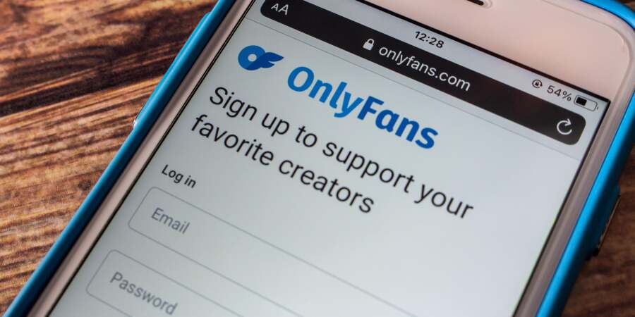 A smartphone displaying the OnlyFans app login screen