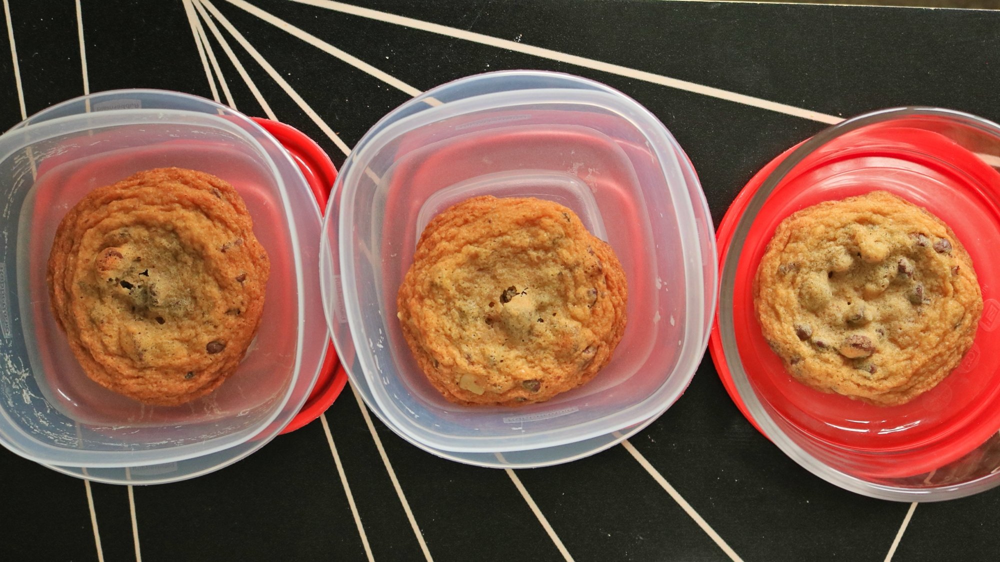 Three cookies each in a different storage container.