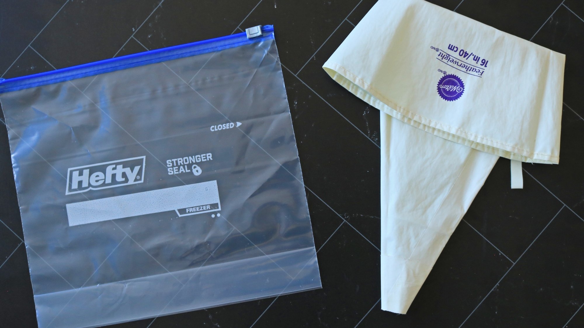 A plastic zip-top bag next to a piping bag.