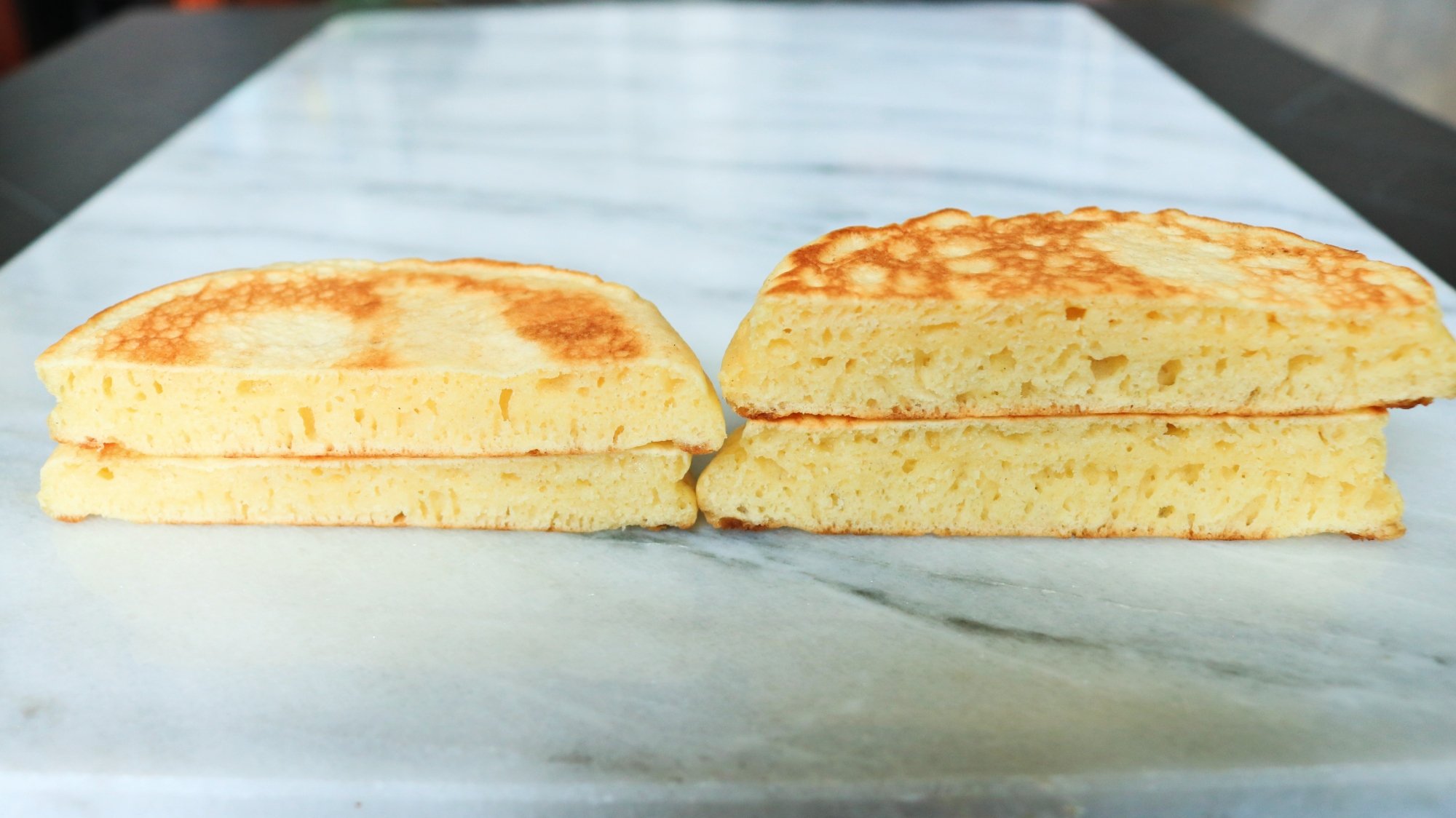 Two pancakes sliced in half so you can see the interior.