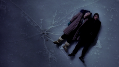 A screenshot from Eternal Sunshine of the Spotless Mind: Jim Carrey and Kate Winslet lying on a frozen lake