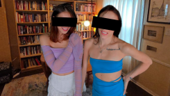 A passthrough VR porn image of two clothed but skimpily clad women appearing to stand in the author's living room. Black bars have been placed over their faces to hide their identities. women