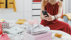 woman taking picture of shoes to sell on an app