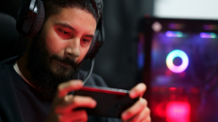 A gamer plays a game on a phone